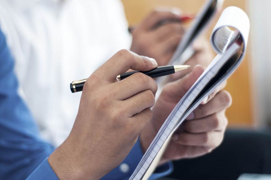 Business people writing on notepad decorative image of journalism_feature_wipnag , Journalism 2016-09-08 20:16:53