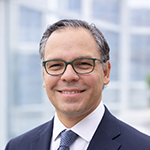 headshot image of Eugene Hernandez